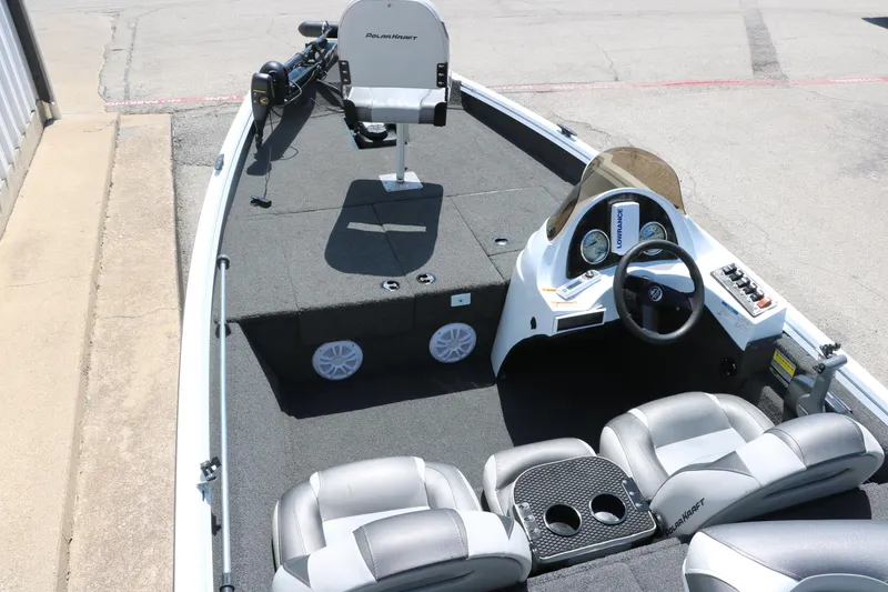 Slide: The Image of 2018 Polar Kraft Bass America TX175 Pro Bass boat interior with seating and control panel. - 11