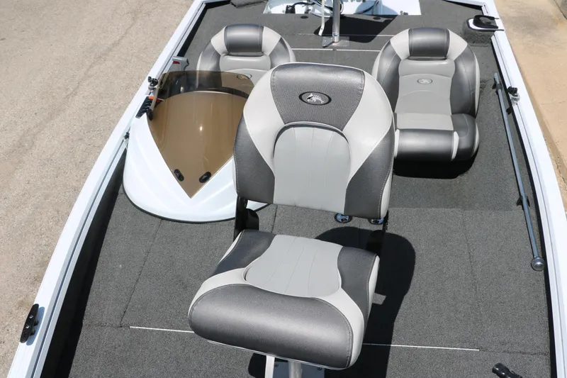 Slide: The Image of 2018 Polar Kraft Bass America TX175 Pro Bass boat interior with gray seating and carpeted deck. - 18