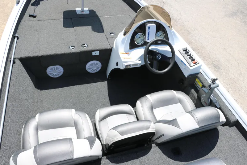 Slide: The Image of 2018 Polar Kraft Bass America TX175 Pro Bass boat interior with steering console and seating. - 21