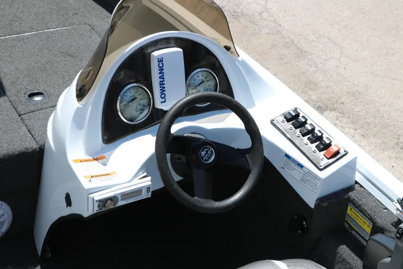 Slide: The Image of 2018 Polar Kraft Bass America TX175 Pro Bass boat dashboard with steering wheel and controls. - 22