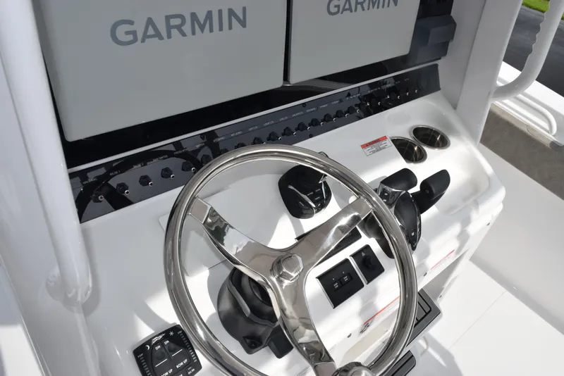 Slide: The Image of 2026 Sea Hunt Gamefish 30 helm with Garmin displays and modern controls. - 11