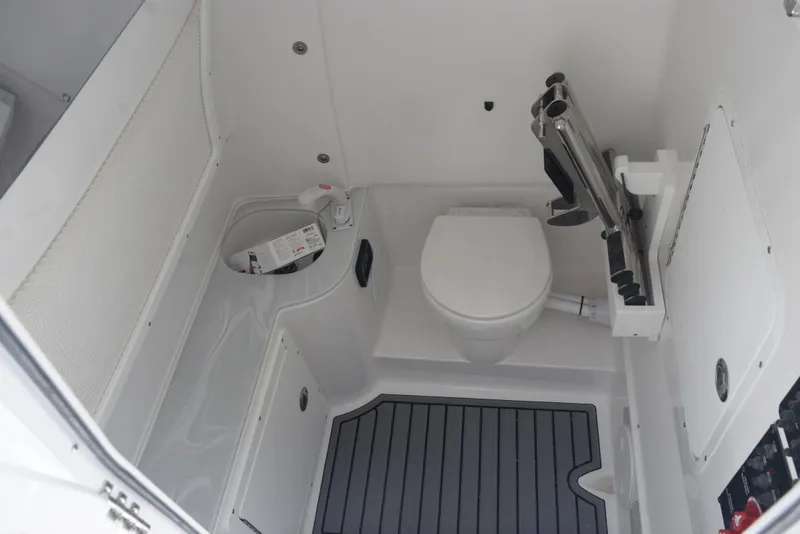 Slide: The Image of 2026 Sea Hunt Gamefish 30 boat interior with toilet and storage area. - 16