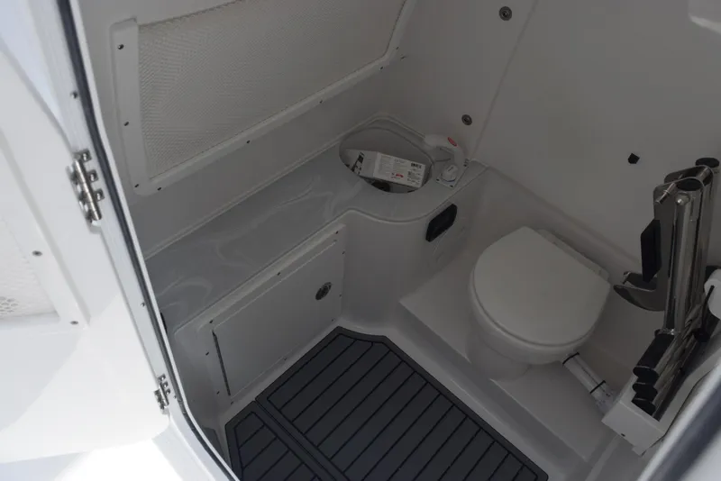Slide: The Image of 2026 Sea Hunt Gamefish 30 boat interior with toilet and storage area. - 17