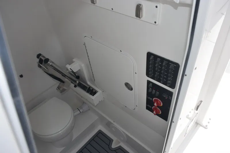 Slide: The Image of 2026 Sea Hunt Gamefish 30 boat interior with toilet and control panel. - 18