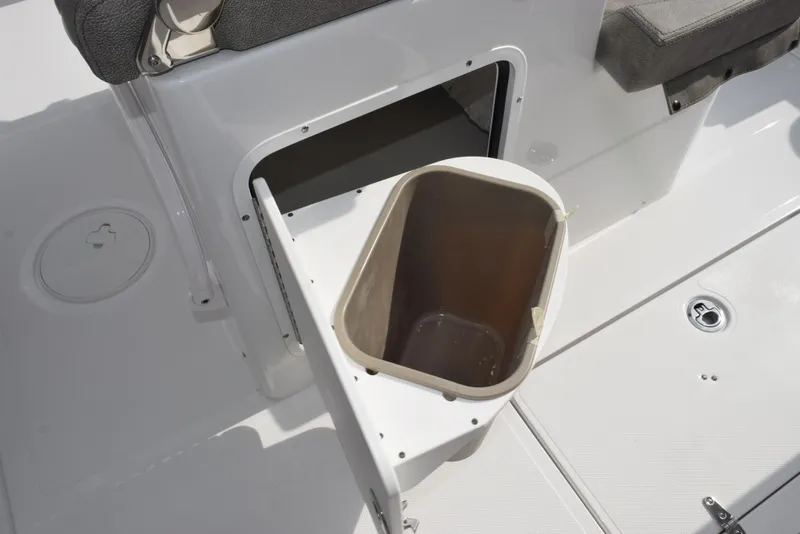 Slide: The Image of 2026 Sea Hunt Gamefish 30 boat with open storage compartment and seating. - 19