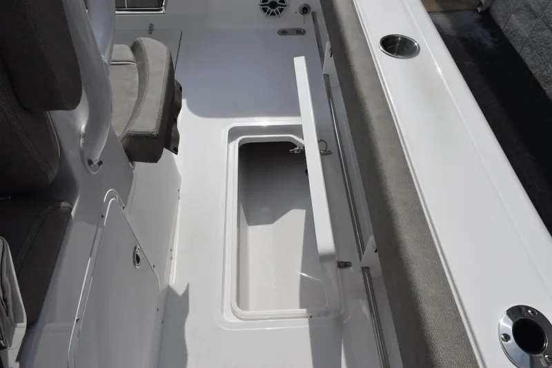 Slide: The Image of 2026 Sea Hunt Gamefish 30 Forward Seating interior with open storage compartment. - 20