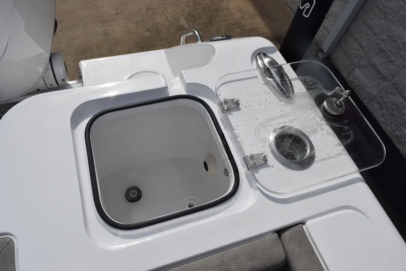 Slide: The Image of 2026 Sea Hunt Gamefish 30 Forward Seating boat with open storage compartment and clear lid. - 21