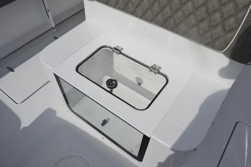 Slide: The Image of 2026 Sea Hunt Gamefish 30 Forward Seating livewell with cushioned seating. - 23