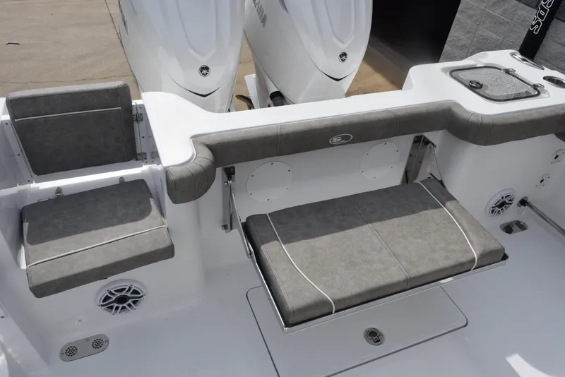 Slide: The Image of 2026 Sea Hunt Gamefish 30 Forward Seating with gray cushioned seats and dual engines. - 6