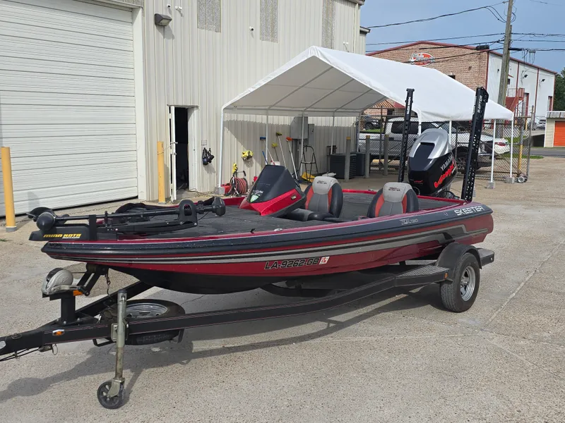 Slide: The Image of 2014 Skeeter ZX 190 boat on trailer, parked outside a building. - 8