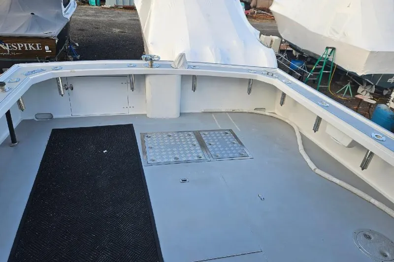Slide: The Image of Open deck of a 2022 Flowers Down East boat, featuring a clean, spacious layout. - 15