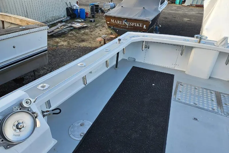 Slide: The Image of 2022 Flowers Down East boat deck with fishing equipment and storage compartments. - 16