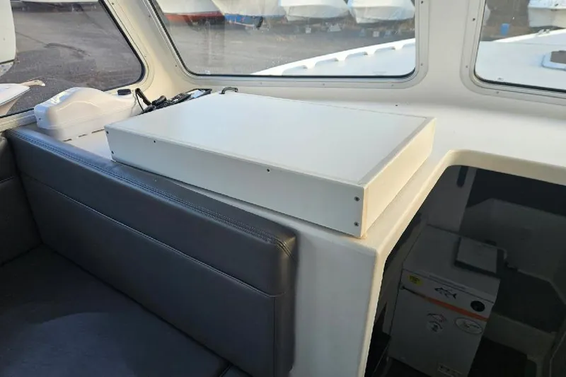 Slide: The Image of Interior of a 2022 Flowers Down East boat with seating and storage. - 18