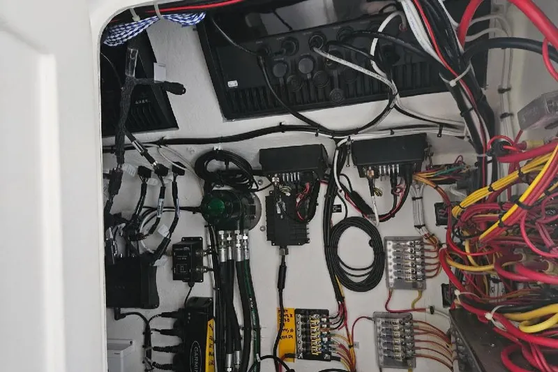 Slide: The Image of Electrical wiring and components inside a 2022 Flowers Down East boat. - 26