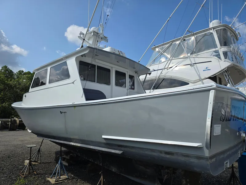 Slide: The Image of Modern boat interior with seating, navigation equipment, and windows, Flowers Down East 2022 model. - 3