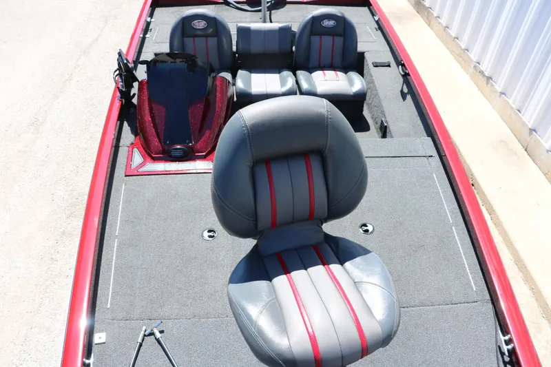 Slide: The Image of 2016 Ranger RT 188 boat interior with gray and red seats, spacious deck. - 21