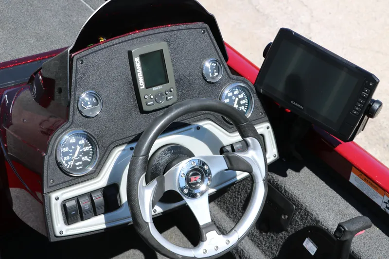 Slide: The Image of Dashboard of 2016 Ranger RT 188 boat with steering wheel and navigation displays. - 25