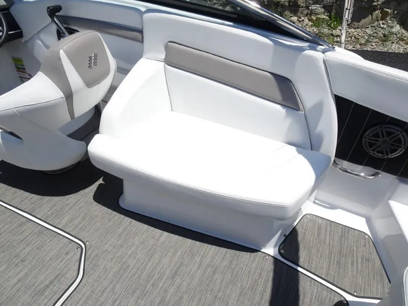 Slide: The Image of 2023 Four Winns H260 boat interior with white seating and modern design. - 12