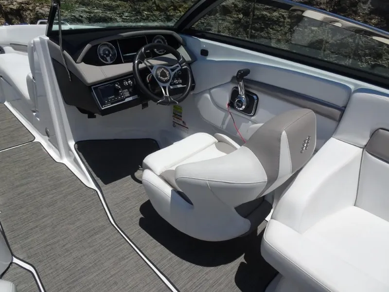 Slide: The Image of 2023 Four Winns H260 boat interior with modern dashboard and comfortable seating. - 13
