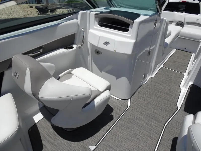 Slide: The Image of Interior of 2023 Four Winns H260 boat, featuring sleek seating and modern design. - 17