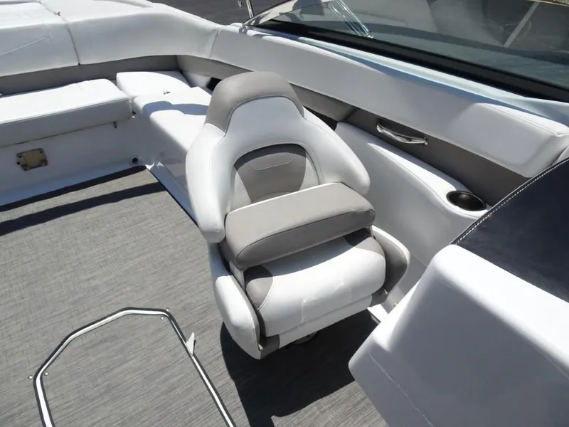 Slide: The Image of 2023 Four Winns H260 boat interior with plush seating and modern design. - 18