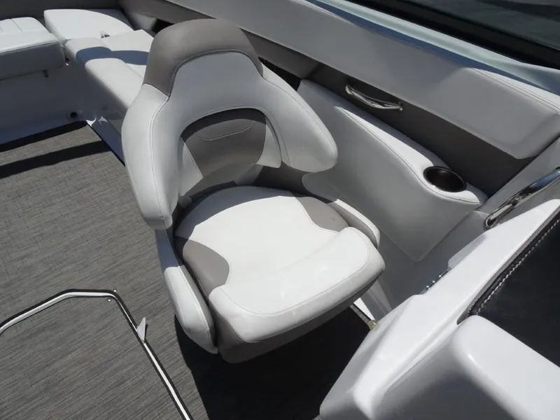 Slide: The Image of 2023 Four Winns H260 boat interior with white and gray seating. - 19