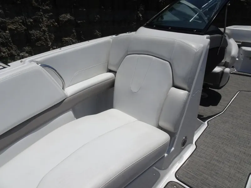 Slide: The Image of 2023 Four Winns H260 boat interior with white seating and sleek design. - 22