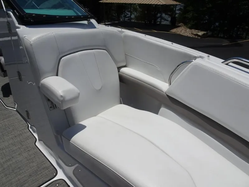Slide: The Image of 2023 Four Winns H260 boat interior with white seating and armrest. - 23