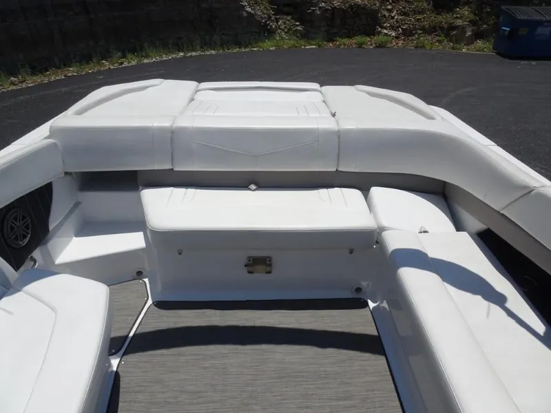 Slide: The Image of 2023 Four Winns H260 boat interior with white seating and spacious layout. - 24