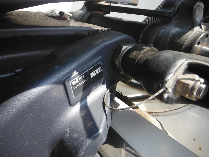 Slide: The Image of Close-up of Yamaha engine component on 2013 Robalo R207 Dual Console boat. - 14