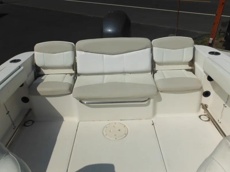 Slide: The Image of 2013 Robalo R207 Dual Console boat interior with cushioned seating. - 17