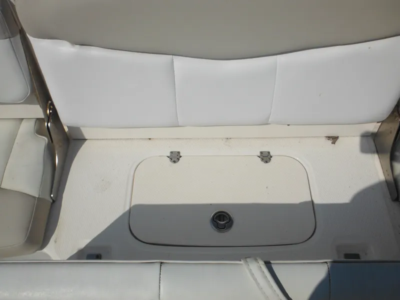 Slide: The Image of 2013 Robalo R207 Dual Console boat seat with storage compartment. - 25