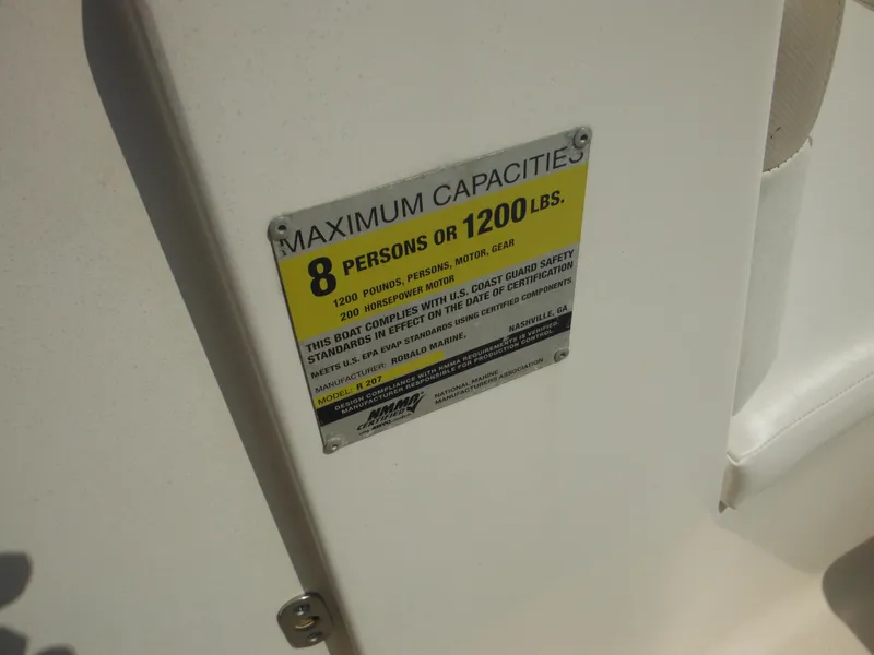 Slide: The Image of Capacity label on 2013 Robalo R207 Dual Console, max 8 persons or 1200 lbs. - 40