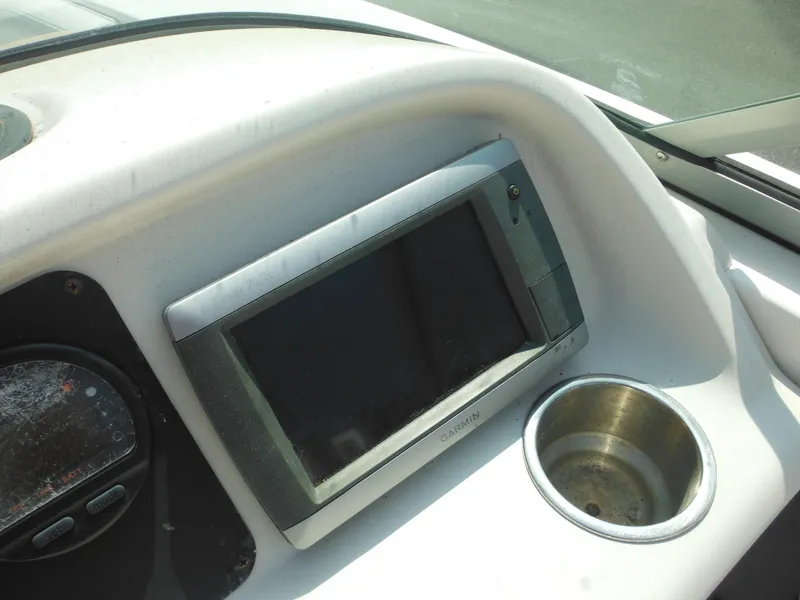 Slide: The Image of Dashboard of 2013 Robalo R207 Dual Console with Garmin display and cup holder. - 47