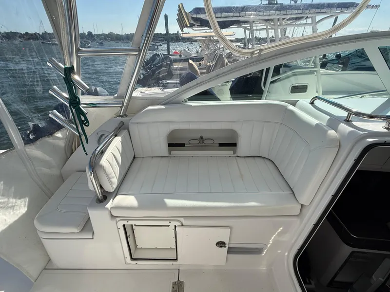 Slide: The Image of 2008 Southport 28 Express boat interior with white seating and ocean view. - 13