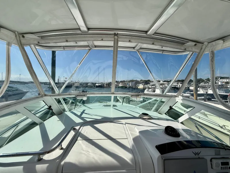 Slide: The Image of Interior view of 2008 Southport 28 Express boat with marina in background. - 18