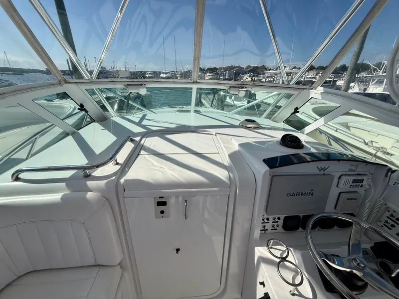 Slide: The Image of 2008 Southport 28 Express boat cockpit with Garmin navigation system, docked at marina. - 19