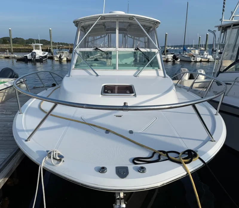 Slide: The Image of 2008 Southport 28 Express boat docked at marina, front view. - 6