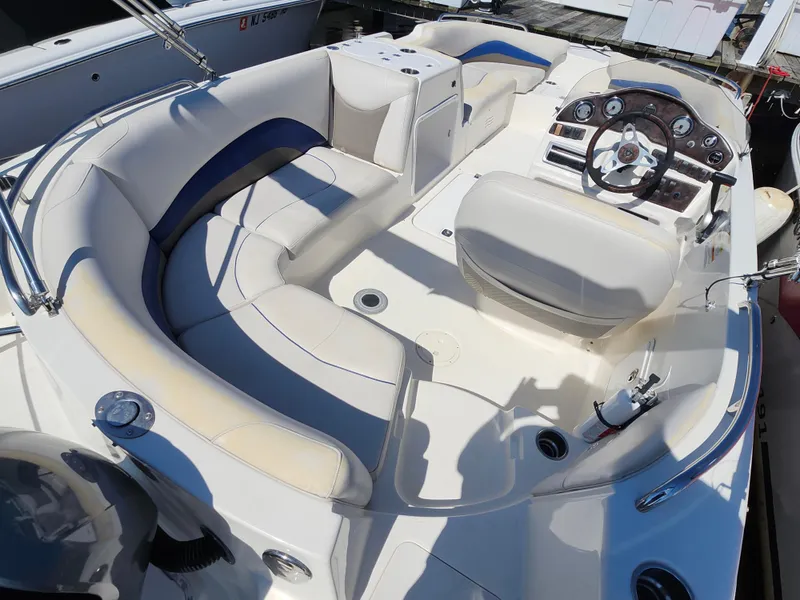 Slide: The Image of 2009 Hurricane SunDeck 2000 OB boat interior with seating and control panel. - 10