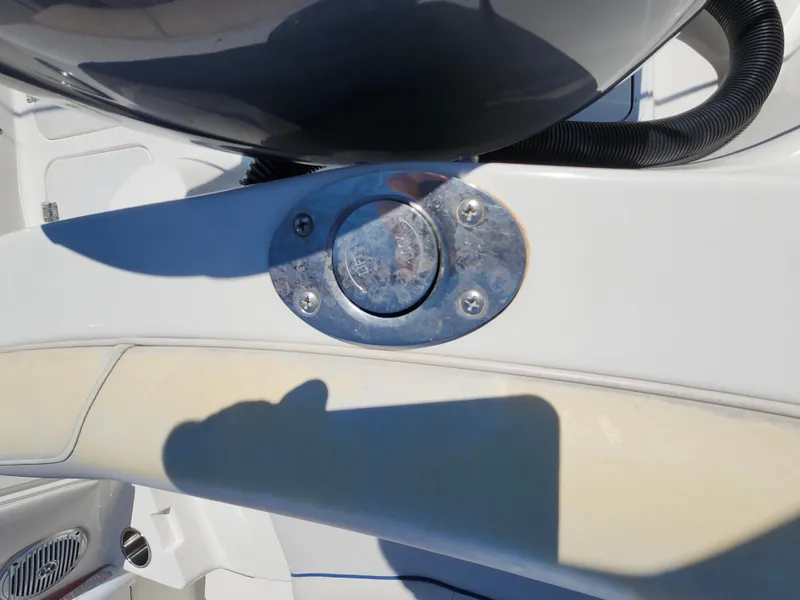 Slide: The Image of 2009 Hurricane SunDeck 2000 OB boat detail with metal fixture and seating. - 14