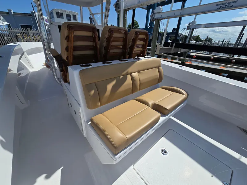 Slide: The Image of 2025 Bahama 35 Super Center Console with tan leather seating and sleek design. - 12