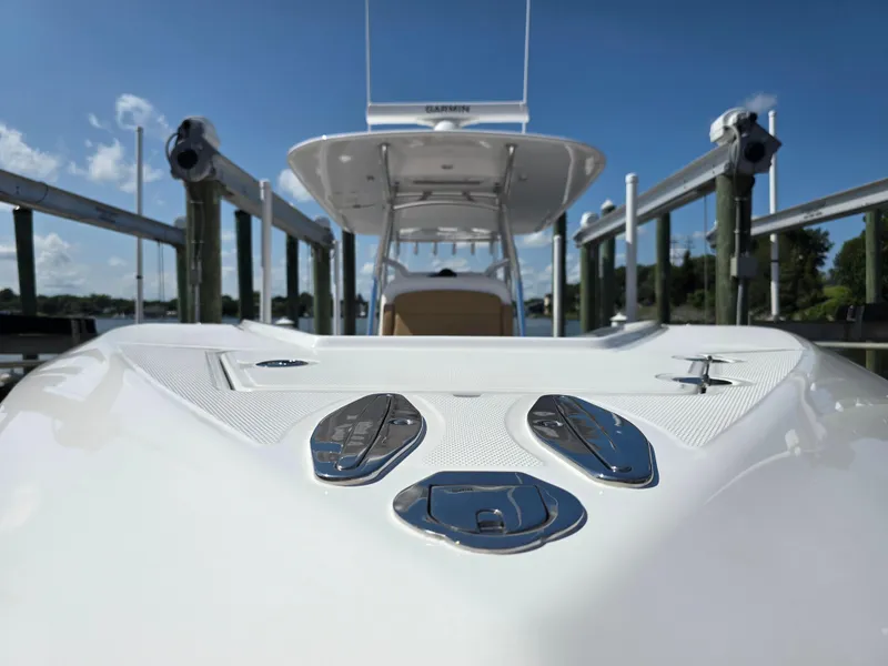 Slide: The Image of 2025 Bahama 35 Super Center Console boat docked under clear blue sky. - 22
