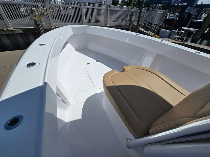 Slide: The Image of 2025 Bahama 35 Super Center Console boat interior with tan seating and sleek design. - 6