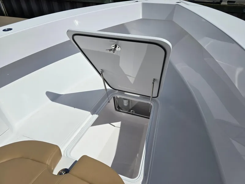 Slide: The Image of 2025 Bahama 35 Super Center Console with open storage compartment. - 9