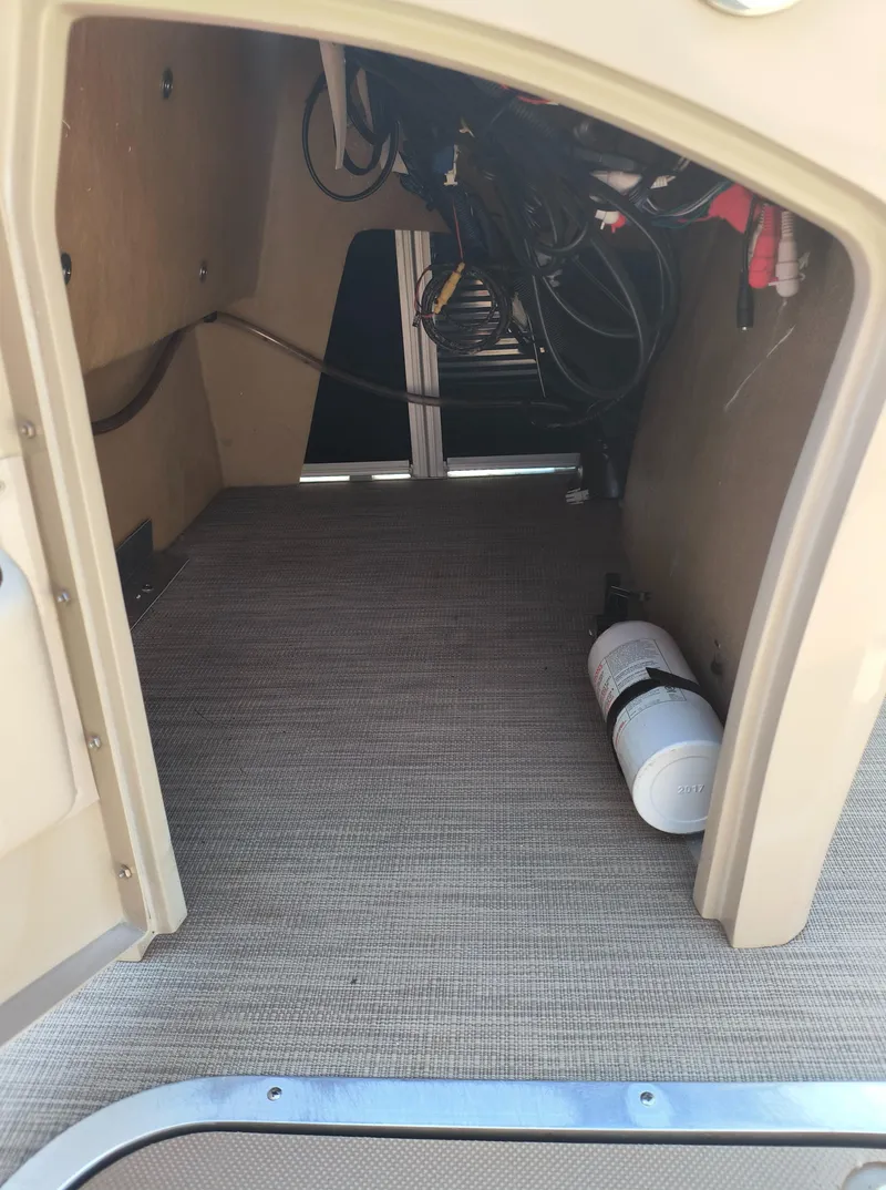 Slide: The Image of Interior view of a 2017 Bennington 24 SSBXP-SPS boat storage compartment. - 19