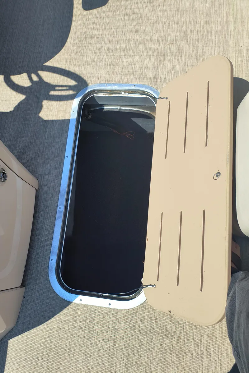 Slide: The Image of Open storage compartment on 2017 Bennington 24 SSBXP-SPS boat deck. - 21