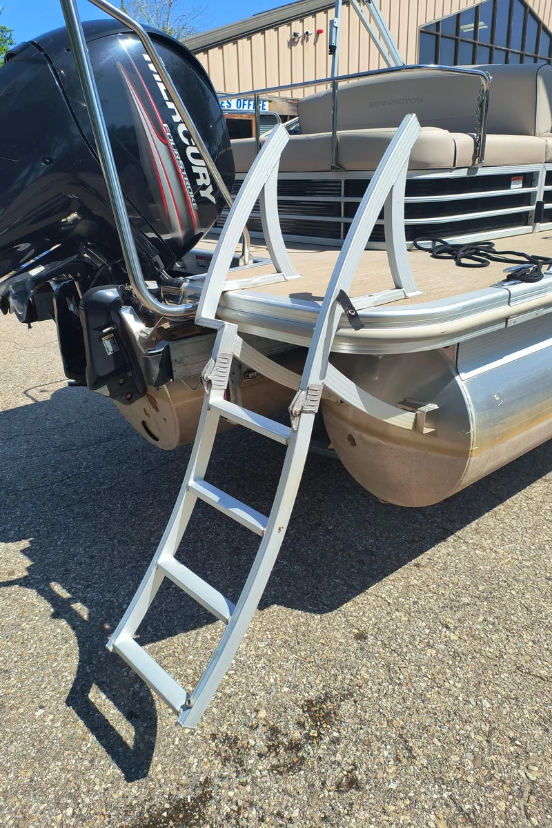 Slide: The Image of 2017 Bennington 24 SSBXP-SPS pontoon boat with Mercury engine and boarding ladder. - 6