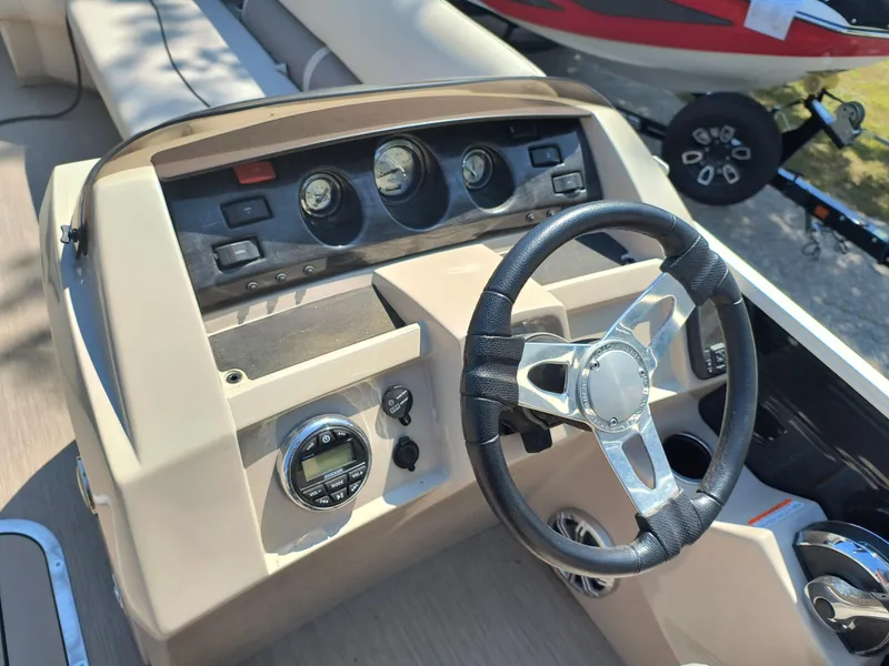 Slide: The Image of Steering console of a 2017 Bennington 24 SSBXP-SPS boat with gauges and controls. - 9