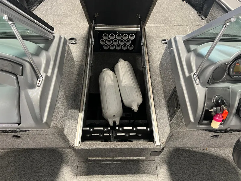 Slide: The Image of 2017 Lund 1875 Pro-V Sport boat interior with storage compartment and fenders. - 10