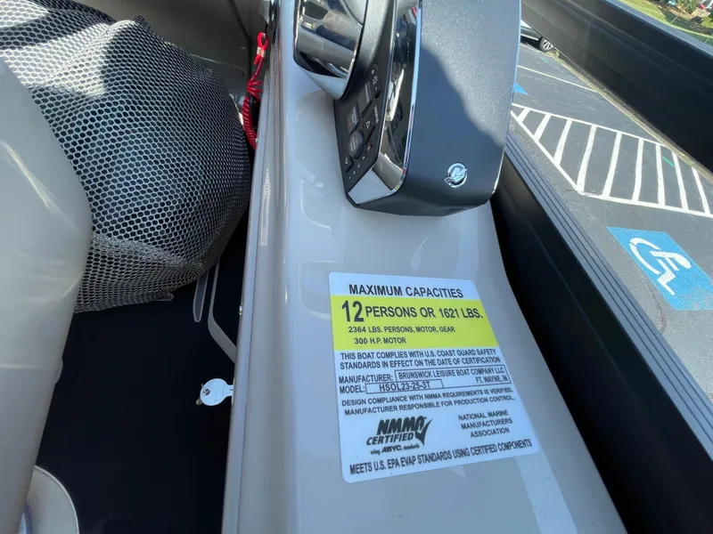 Slide: The Image of 2026 Harris Solstice 230 boat capacity label, seating for 12, 1621 lbs limit. - 14